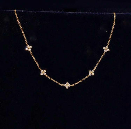 Collier doré femme avec pendentifs fleuris en zirconium